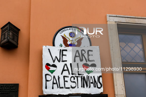 Pro-Palestine placard is seen against the United States's consulate in Krakow sign as Palestinians and their supporters hold a protest in su...