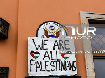 Pro-Palestine placard is seen against the United States's consulate in Krakow sign as Palestinians and their supporters hold a protest in su...