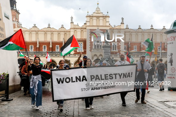 Palestinians and their supporters hold a protest in support of Palestine and against Israeli war actions in the Gaza Strip in the Main Marke...