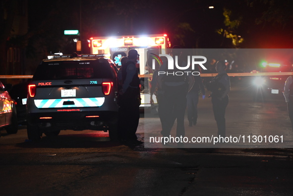 Chicago Police are present and an ambulance is at the scene. A male victim is dying after being shot twenty-five times in a double shooting...