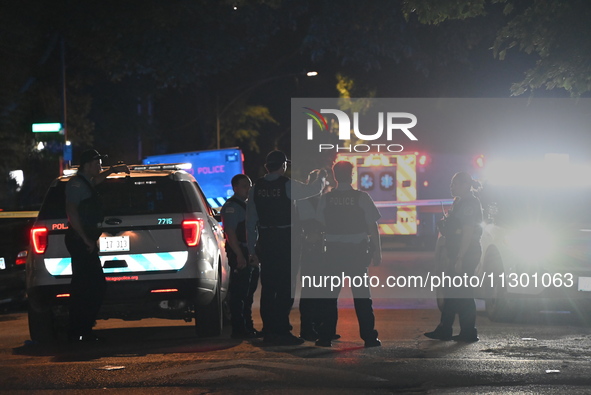 Chicago Police are present and an ambulance is at the scene. A male victim is dying after being shot twenty-five times in a double shooting...