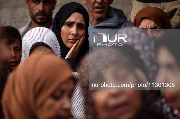 Palestinians are mourning the death of their relatives in an Israeli strike at the Al-Aqsa Martyrs Hospital in Deir al-Balah in the central...