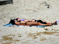 People are relaxing on the beach next to a newly opened bomb shelter in Odesa, Ukraine, on May 31, 2024. NO USE RUSSIA. NO USE BELARUS. (