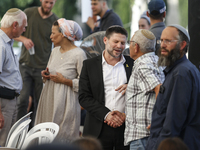 Israel's Finance Minister Bezalel Smotric is looking on as he addresses the relatives of Israelis being held hostage by Palestinian Hamas mi...