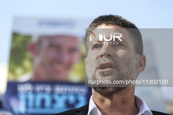 Israel's Finance Minister Bezalel Smotric is looking on as he addresses the relatives of Israelis being held hostage by Palestinian Hamas mi...