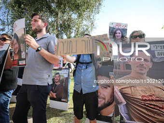 Relatives and friends of Israelis held hostage by Palestinian Hamas militants in the Gaza Strip are gathering to listen to the Israeli Finan...