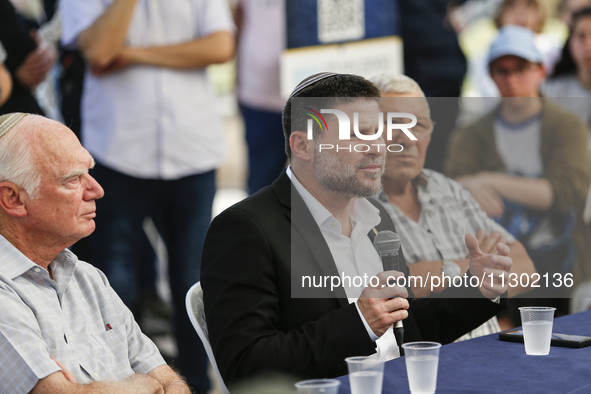 Israel's Finance Minister Bezalel Smotric is looking on as he addresses the relatives of Israelis being held hostage by Palestinian Hamas mi...