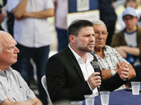 Israel's Finance Minister Bezalel Smotric is looking on as he addresses the relatives of Israelis being held hostage by Palestinian Hamas mi...