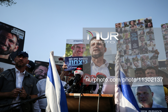 Israel's Finance Minister Bezalel Smotric is looking on as he addresses the relatives of Israelis being held hostage by Palestinian Hamas mi...