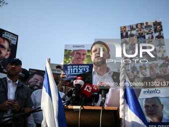 Israel's Finance Minister Bezalel Smotric is looking on as he addresses the relatives of Israelis being held hostage by Palestinian Hamas mi...