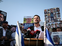 Israel's Finance Minister Bezalel Smotric is looking on as he addresses the relatives of Israelis being held hostage by Palestinian Hamas mi...