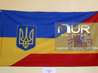 A flag with the colors of Spain and Ukraine is being exhibited during the open day held at the Bruch Barracks in Barcelona, Spain, on June 2...