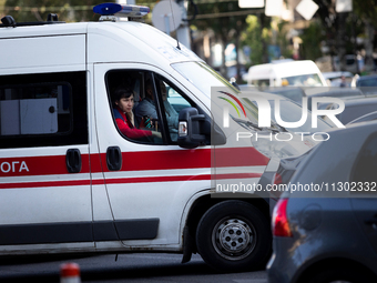 An ambulance is struggling through the traffic in the street of Kyiv, capital of Ukraine, in Kyiv, Ukraine, on June 3, 2024. NO USE RUSSIA....