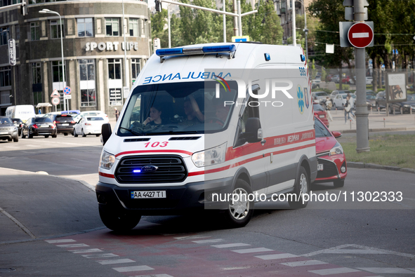 An ambulance is struggling through the traffic in the street of Kyiv, capital of Ukraine, in Kyiv, Ukraine, on June 3, 2024. NO USE RUSSIA....