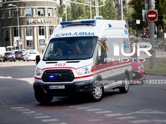 An ambulance is struggling through the traffic in the street of Kyiv, capital of Ukraine, in Kyiv, Ukraine, on June 3, 2024. NO USE RUSSIA....