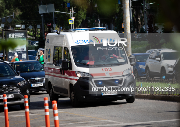 An ambulance is struggling through the traffic in the street of Kyiv, capital of Ukraine, in Kyiv, Ukraine, on June 3, 2024. NO USE RUSSIA....