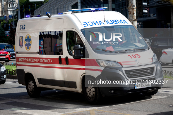 An ambulance is struggling through the traffic in the street of Kyiv, capital of Ukraine, in Kyiv, Ukraine, on June 3, 2024. NO USE RUSSIA....