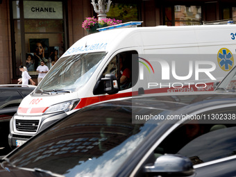 An ambulance is struggling through the traffic in the street of Kyiv, capital of Ukraine, in Kyiv, Ukraine, on June 3, 2024. NO USE RUSSIA....