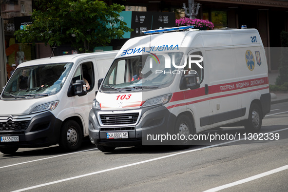 An ambulance is struggling through the traffic in the street of Kyiv, capital of Ukraine, in Kyiv, Ukraine, on June 3, 2024. NO USE RUSSIA....