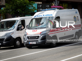 An ambulance is struggling through the traffic in the street of Kyiv, capital of Ukraine, in Kyiv, Ukraine, on June 3, 2024. NO USE RUSSIA....