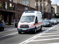 An ambulance is struggling through the traffic on Khreshchatyk Street in Kyiv, Ukraine, on June 3, 2024. NO USE RUSSIA. NO USE BELARUS. (