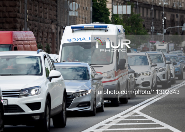 An ambulance is struggling through the traffic in the street of Kyiv, capital of Ukraine, in Kyiv, Ukraine, on June 3, 2024. NO USE RUSSIA....