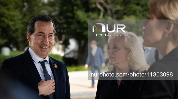 Reps. Jamie Raskin (D-MD) (left) and Debbie Dingell (center)  talk with Rep. Deborah Ross (D-NC) prior to a press conference at the Capitol...