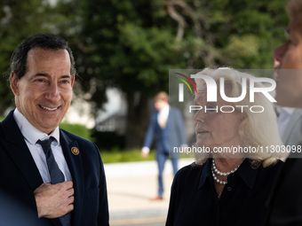 Reps. Jamie Raskin (D-MD) (left) and Debbie Dingell (center)  talk with Rep. Deborah Ross (D-NC) prior to a press conference at the Capitol...