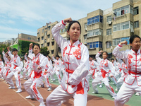 Students are practicing martial arts during a class break at the Second Experimental Primary School in Guanyun County, Lianyungang city, in...