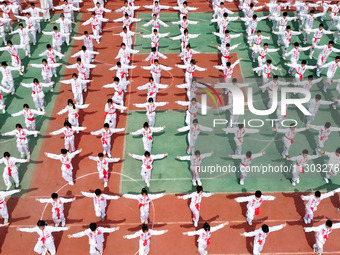 Students are practicing martial arts during a class break at the Second Experimental Primary School in Guanyun County, Lianyungang city, in...