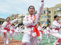 Students are practicing martial arts during a class break at the Second Experimental Primary School in Guanyun County, Lianyungang city, in...