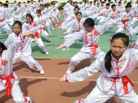 Students are practicing martial arts during a class break at the Second Experimental Primary School in Guanyun County, Lianyungang city, in...