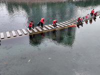 Volunteers are picking up debris at the Black Dragon Cave Scenic spot in Handan, China, on June 4, 2024. (