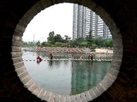 Volunteers are picking up debris at the Black Dragon Cave Scenic spot in Handan, China, on June 4, 2024. (