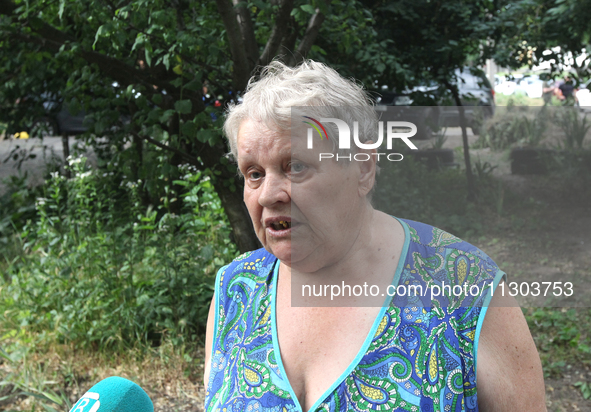 An elderly woman is speaking to the press following a nighttime Russian missile attack in Dnipro, Ukraine, on June 4, 2024. Ukraine's air de...