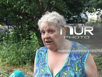 An elderly woman is speaking to the press following a nighttime Russian missile attack in Dnipro, Ukraine, on June 4, 2024. Ukraine's air de...