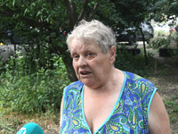 An elderly woman is speaking to the press following a nighttime Russian missile attack in Dnipro, Ukraine, on June 4, 2024. Ukraine's air de...