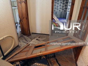 A knocked-out door is being seen in a house after a nighttime Russian missile strike in Dnipro, Ukraine, on June 4, 2024. Ukraine's air defe...