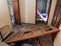 A knocked-out door is being seen in a house after a nighttime Russian missile strike in Dnipro, Ukraine, on June 4, 2024. Ukraine's air defe...