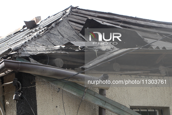 A house is being damaged by the falling debris of downed Russian missiles in Dnipro, Ukraine, on June 4, 2024. Ukraine's air defense forces...