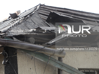 A house is being damaged by the falling debris of downed Russian missiles in Dnipro, Ukraine, on June 4, 2024. Ukraine's air defense forces...