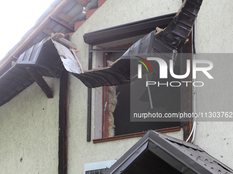 A house is being damaged by the falling debris of downed Russian missiles in Dnipro, Ukraine, on June 4, 2024. Ukraine's air defense forces...