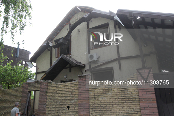 A house is being damaged by the falling debris of downed Russian missiles in Dnipro, Ukraine, on June 4, 2024. Ukraine's air defense forces...