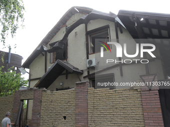 A house is being damaged by the falling debris of downed Russian missiles in Dnipro, Ukraine, on June 4, 2024. Ukraine's air defense forces...