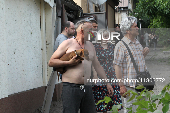 Locals are looking at damage caused by a nighttime Russian missile strike in Dnipro, Ukraine, on June 4, 2024. Ukraine's air defense forces...