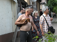 Locals are looking at damage caused by a nighttime Russian missile strike in Dnipro, Ukraine, on June 4, 2024. Ukraine's air defense forces...