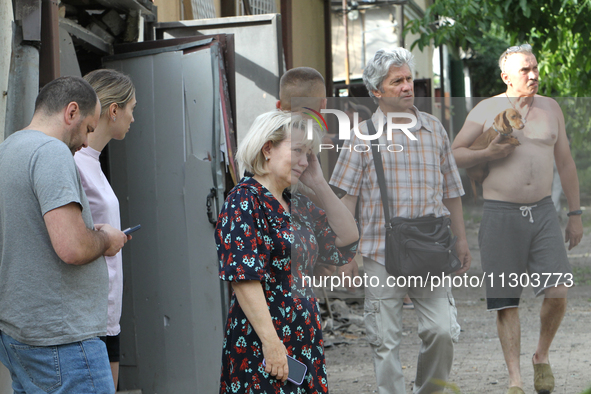 Locals are looking at damage caused by a nighttime Russian missile strike in Dnipro, Ukraine, on June 4, 2024. Ukraine's air defense forces...