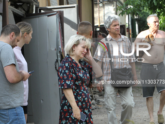 Locals are looking at damage caused by a nighttime Russian missile strike in Dnipro, Ukraine, on June 4, 2024. Ukraine's air defense forces...