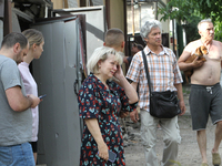 Locals are looking at damage caused by a nighttime Russian missile strike in Dnipro, Ukraine, on June 4, 2024. Ukraine's air defense forces...