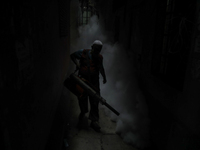 A municipal worker from the Department of Health Service is fumigating vapor to stem the spread of dengue in Dhaka, Bangladesh, on June 4, 2...